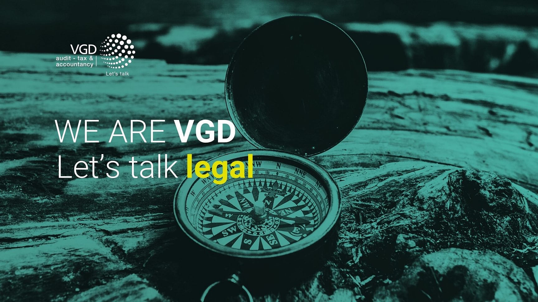 Een banner met de tekst: We are VGD, let's talk legal. Met op de achtergrond een afbeelding van een compas dat op de grond ligt.